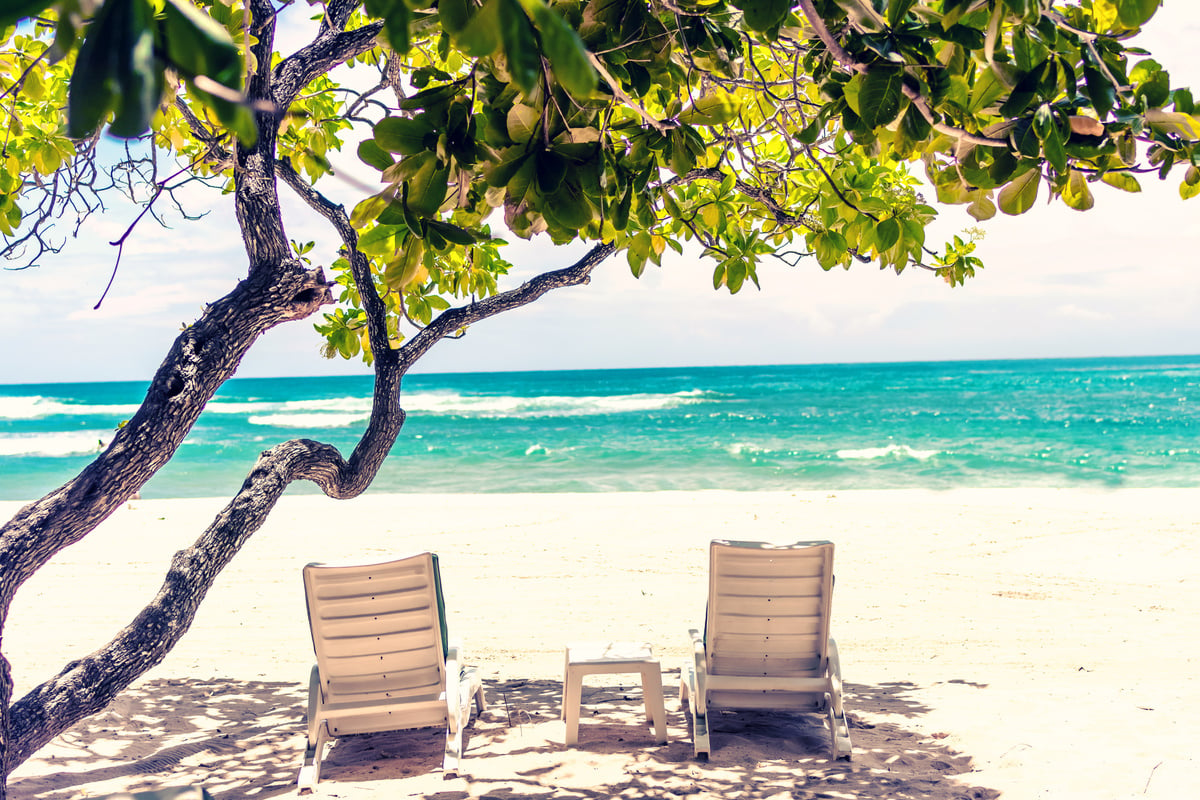 Outdoor Loungers On Seashore